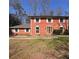 Charming two-story brick home with symmetrical design and classic white window shutters at 4625 Orkney Sw Ln, Atlanta, GA 30331
