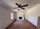 Living room showing ceiling fan, white brick fireplace, ready to be renovated and customized at 4625 Orkney Sw Ln, Atlanta, GA 30331