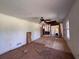 Spacious living room ready for renovation, featuring exposed flooring and ceiling fan at 4625 Orkney Sw Ln, Atlanta, GA 30331