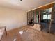Partially renovated living room exhibiting open concept and some exposed studs at 4625 Orkney Sw Ln, Atlanta, GA 30331