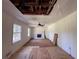 Renovate this living room space with windows, a fireplace, and damaged ceiling at 4625 Orkney Sw Ln, Atlanta, GA 30331