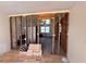 Renovated living room shows exposed wall studs and open floor plan potential at 4625 Orkney Sw Ln, Atlanta, GA 30331