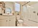 Bathroom featuring vanity, toilet, and tub-shower combo with a sliding glass door at 2461 Melton Common Dr, Dacula, GA 30019