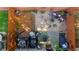 Top-down aerial view of a fenced backyard with gravel, mulch, a fire pit, and patio furniture at 2474 Whiteoak Se Run # 18, Smyrna, GA 30080