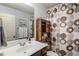 Bathroom featuring single vanity sink, a mirror, and a decorative shower curtain at 2474 Whiteoak Se Run # 18, Smyrna, GA 30080