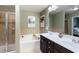Bathroom featuring double vanity sinks, a shower, and a soaking tub at 2474 Whiteoak Se Run # 18, Smyrna, GA 30080