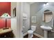 Half bath featuring neutral walls, pedestal sink, and decorative mirror and prints at 2474 Whiteoak Se Run # 18, Smyrna, GA 30080