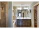 Bathroom featuring double vanity sinks, a soaking tub, and a tiled shower with modern fixtures at 2474 Whiteoak Se Run # 18, Smyrna, GA 30080