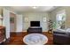 Well-lit bedroom featuring hardwood floors, a round rug, and ample natural light at 2474 Whiteoak Se Run # 18, Smyrna, GA 30080