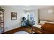 Brightly lit bedroom with hardwood floors, a workstation, and a comfortable bed at 2474 Whiteoak Se Run # 18, Smyrna, GA 30080
