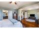 Spacious bedroom with hardwood floors, a walk-in closet, and an ensuite bathroom at 2474 Whiteoak Se Run # 18, Smyrna, GA 30080