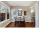 Sunlit dining room boasts hardwood floors, and a view to the outdoors at 2474 Whiteoak Se Run # 18, Smyrna, GA 30080