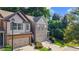Beautiful townhome with well-manicured lawn and brick accents on a sunny day at 2474 Whiteoak Se Run # 18, Smyrna, GA 30080