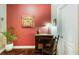 Cozy hallway featuring a red wall and hardwood floors at 2474 Whiteoak Se Run # 18, Smyrna, GA 30080