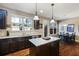 Kitchen with granite countertops, stainless steel appliances, a center island, and a view to the backyard at 2474 Whiteoak Se Run # 18, Smyrna, GA 30080