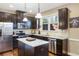 Kitchen features stainless steel appliances, granite countertops, island, and eat-in breakfast nook at 2474 Whiteoak Se Run # 18, Smyrna, GA 30080
