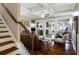 Open-concept living room with hardwood floors, fireplace, and plenty of natural light at 2474 Whiteoak Se Run # 18, Smyrna, GA 30080