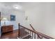 Staircase with wood and wrought iron railing leading to the upper level at 2474 Whiteoak Se Run # 18, Smyrna, GA 30080