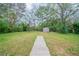 Spacious backyard featuring a storage shed and plenty of room for outdoor activities at 3680 Brookcrest Cir, Decatur, GA 30032
