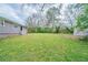 Large grassy backyard with storage shed and potential for landscaping at 3680 Brookcrest Cir, Decatur, GA 30032