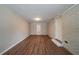 Finished basement with luxury vinyl plank flooring and painted brick accent wall at 3680 Brookcrest Cir, Decatur, GA 30032
