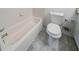 Compact bathroom with white subway tile, toilet, and tub with shower at 3680 Brookcrest Cir, Decatur, GA 30032