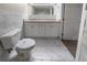 Bright bathroom with double vanity, granite countertop, marble tile flooring, and marble tiled walls at 3680 Brookcrest Cir, Decatur, GA 30032