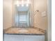 Bright bathroom vanity with granite countertop, mirror, and modern sink fixture at 3680 Brookcrest Cir, Decatur, GA 30032