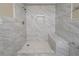 Bathroom with marble tiles, shower bench, and wall niche at 3680 Brookcrest Cir, Decatur, GA 30032