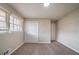 This bedroom features neutral paint, carpeted floors, and a window for natural light at 3680 Brookcrest Cir, Decatur, GA 30032