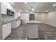 Updated kitchen featuring white cabinets, stainless appliances, and a mosaic backsplash at 3680 Brookcrest Cir, Decatur, GA 30032