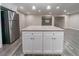 Bright kitchen with white island, stainless steel fridge and appliances, offering a functional layout at 3680 Brookcrest Cir, Decatur, GA 30032