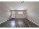 Bright living room featuring wood-look floors, neutral walls, and natural light from the window at 3680 Brookcrest Cir, Decatur, GA 30032