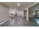 Open-concept living area showcasing wood floors, with kitchen views, creating a spacious feel at 3680 Brookcrest Cir, Decatur, GA 30032