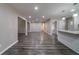Open living area with wood floors, leading into kitchen, for modern living at 3680 Brookcrest Cir, Decatur, GA 30032