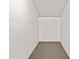 Unfinished basement with concrete ceiling and carpeted floor at 3973 Elmscourt Dr, Stone Mountain, GA 30083