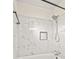 Bathroom featuring a bathtub with marble tiled wall at 3973 Elmscourt Dr, Stone Mountain, GA 30083