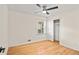Bedroom with a ceiling fan, a window, and closet with sliding doors at 3973 Elmscourt Dr, Stone Mountain, GA 30083