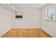 Bright bedroom with hardwood floors and natural light streaming through the double windows at 3973 Elmscourt Dr, Stone Mountain, GA 30083