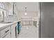 Renovated kitchen features white cabinets, light marble countertops, and stainless steel appliances at 3973 Elmscourt Dr, Stone Mountain, GA 30083