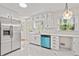 Modern kitchen with white cabinets, stainless steel appliances, and bright marble countertops at 3973 Elmscourt Dr, Stone Mountain, GA 30083