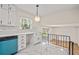 Bright, updated kitchen with white cabinets and countertops overlooking the living space at 3973 Elmscourt Dr, Stone Mountain, GA 30083