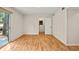 Living room with hardwood floors and large sliding glass door to deck at 3973 Elmscourt Dr, Stone Mountain, GA 30083