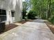 View of a concrete back patio, offering an inviting space for outdoor lounging and entertaining at 4424 Lower Fayetteville Rd, Sharpsburg, GA 30277