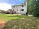 A large backyard with a deck and patio and lush greenery offering ample space for outdoor activities at 4424 Lower Fayetteville Rd, Sharpsburg, GA 30277