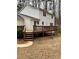 Backyard view of a two-story home with a wooden deck at 4424 Lower Fayetteville Rd, Sharpsburg, GA 30277