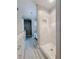 Elegant bathroom with a glass-enclosed shower, chandelier, and stylish tiled floors at 4424 Lower Fayetteville Rd, Sharpsburg, GA 30277