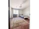 Cozy bedroom with hardwood floors, a vintage rug, and a bright window at 4424 Lower Fayetteville Rd, Sharpsburg, GA 30277