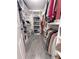 Spacious walk-in closet with built-in shelving and ample storage space at 4424 Lower Fayetteville Rd, Sharpsburg, GA 30277