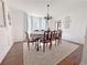 Elegant dining room with a chandelier and large windows providing ample natural light at 4424 Lower Fayetteville Rd, Sharpsburg, GA 30277